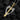 Angled shot of silver angel wing necklace with gold sword center displaying intricate metalwork and design