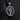 Angled view of silver Nefertiti necklace showing detailed profile relief and oxidized antique finish