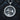 Angled view of silver Anubis Bastet pendant showing thick rim with hieroglyphs and oxidized finish detail