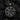 Close-up of the handcrafted ornamental swirl pendant revealing the oxidized silver finish and dynamic sweeping vine motifs