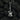 Oxidized silver skull guitar pendant displayed on rugged black coals emphasizing its dark gothic style