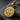 Back of Saint Benedict pendant displaying the cross symbol and Vade Retro Satana letters on slate