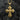 Two-tone silver cross pendant featuring gold star accent on textured dark surface