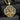Gold plated sterling silver pendant of Jesus holding the lost lamb with detailed relief work displayed on dark texture