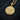 Rose gold Zeus head necklace pendant with lightning symbols in angled view on textured surface