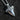 Detailed look at the ornate bail and wave patterns on a sterling silver shark tooth pendant designed for men