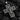 Angled close-up of handcrafted silver crucifix pendant showing oxidized finish and durable metalwork design