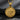 Back view of silver medallion pendant featuring a textured basket weave pattern design on dark background