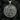 Angled close-up of wolf and fox medallion pendant highlighting handcrafted details and premium metal thickness
