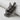 Angled view of the handcrafted silver gorilla pendant with a crown, highlighting the oxidized finish and textured mane details.