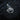 Angled view of gold plated lion head pendant featuring detailed crown and mane texture on textured black surface