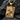 Close-up of the handcrafted Queen of Spades jewelry resting on dark stone highlighting its luxurious 3D textures
