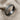 Detailed close-up of the handcrafted twisted rope ring displaying its rich oxidized silver finish on linen fabric.