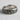 Close-up of the handcrafted scrollwork band ring showcasing detailed filigree patterns and dark oxidized contrast