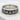 Close-up of the oxidized silver Celtic Claddagh ring resting on a textured white stone surface showcasing details.