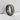 Close-up of premium 925 silver katana band ring showcasing raised gold sword relief and intricate Japanese wave engraving.