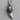 Angled view of handcrafted silver wolf pendant showing the transition from fur to smooth fang