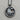 Close-up of the premium 925 sterling silver crab pendant resting on a natural wood texture showing intricate craftsmanship.