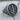 Close-up of handcrafted Letter J Signet Ring resting on a textured wooden surface highlighting the deep oxidized finish