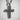 Close-up macro shot of the handcrafted floral cross pendant showing intricate vintage silver details and rich shadows