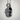 Close-up of the vintage shoe pendant's hollow interior and intricate oxidized silver craftsmanship with shadow