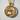 Close-up of the 925 sterling silver and gold vermeil panther pendant showing intricate texture against a white wall
