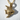 Close-up of handcrafted tropical fish pendant in 14K gold vermeil with prominent textures and hard shadow details