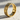 Close-up sunlight view of the lizard scale band ring showing the intricate organic metalwork and brilliant reflections.