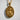 Gold Saint Gabriel pendant resting on a textured white background showcasing its radiant and divine design