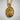 Close-up of the handcrafted Saint James pendant in gold vermeil highlighting the apostle staff and shell