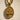 Close-up of oval Saint Mercurius pendant featuring intricate swords and oxidized silver depth under gold vermeil