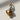 Close-up of handcrafted peeled banana pendant highlighting the textured fruit and smooth peel in oxidized silver
