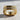 Close-up of the euro shank wedding ring showcasing the square band and embedded sparkling stones on textured stone.