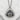 Onigiri nori wrap pendant, oxidized finish, front view on stone