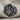 Saint Uriel Ring, oxidized silver, front view on textured fabric