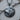Close-up angled view of handcrafted 925 sterling silver wolf pendant highlighting relief design and bail