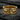 Close-up of handcrafted ring showing textured bear fur and jagged ice design details on wedding band