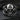 Side profile of silver freemason ring displaying intricate gothic skull details and masonic emblems on dark stone background