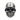 Front view of the silver soldier skull ring, showcasing the detailed facial structure and military helmet on a textured surface.