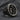 The silver Saint Peter ring worn with other gothic-style rings, highlighting its versatility as a piece of men's jewelry.