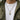 Front view of man wearing oxidized silver Masonic dog tag pendant with an olive green jacket over a white t-shirt