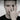 Man wearing handcrafted oxidized silver dragon eye ring on middle finger in modern lifestyle portrait