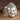 Buddha Head Ring, polished, product photo on textured surface
