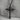 Black Stone Cross Pendant, oxidized, angled product photo on stone stand