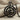 North Star Compass Pendant, black rhodium, front view on stone block