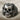 Skull and Roses Ring, oxidized silver, front view on fabric background