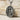Saint Raphael pendant, oxidized silver, product photo on stone