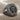 Aquarius Skull Ring, oxidized silver, angled product view on fabric