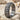 Quilted Lattice Ring, oxidized silver, angled product view on sand