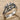 Three Woven Branch Ring, oxidized silver, angled studio photo
